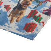 Skye Terrier Running in Snow with Christmas Hat カッティングボード (角)
