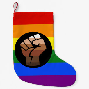 SlipperyJoeのクィア・ピープル・カラー・フラグを掲げた拳 スモールクリスマスストッキング