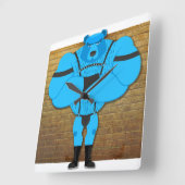 SlipperyJoeのゲイの筋肉は漫画のThongのリードを負担 スクエア壁時計 (傾斜)