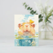 Smiling Capybara Swimming with Small Yellow Bird ポストカード (スタンド正面)