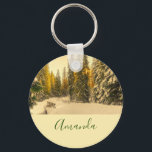 Snow Covered Pine Trees Forest Nature Photo キーホルダー<br><div class="desc">A key chain with a beautiful nature photograph. An isolated winter path with tall snow covered pine trees. 
A golden twilight hue creates a magical feel to this photo.</div>