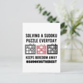 Solving a sudoku puzzle a everyday ポストカード (スタンド正面)