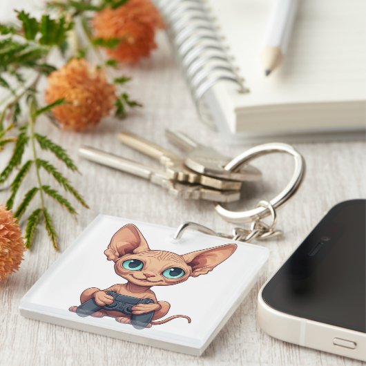 Sphynx Cat Holding Game Controller キーホルダー (正面右)