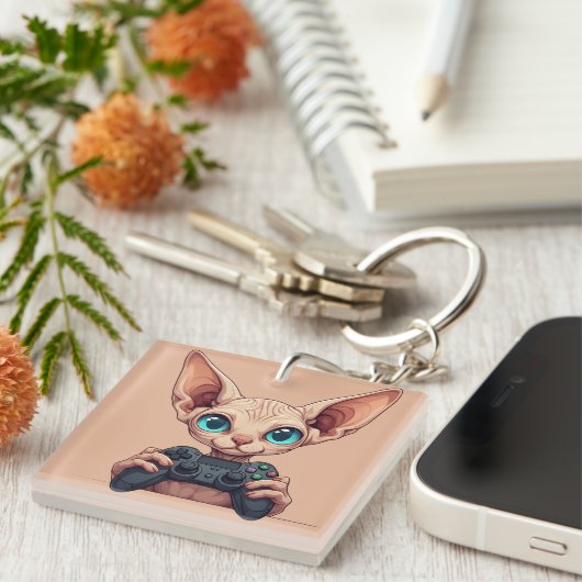 Sphynx Cat Holding Game Controller キーホルダー (正面右)