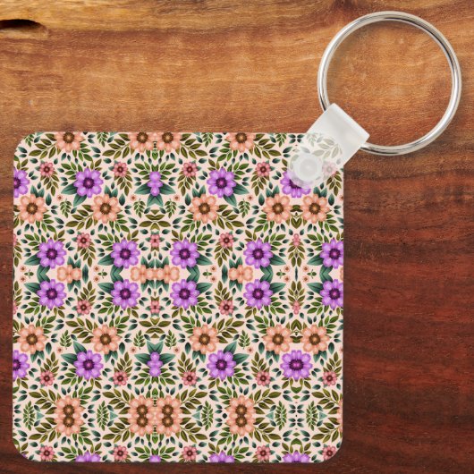 Square keychain showcasing a vibrant floral キーホルダー (裏面)