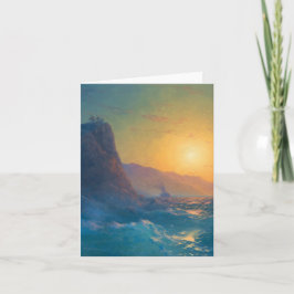 Steep rocky coast and a rough sea at sunset カード