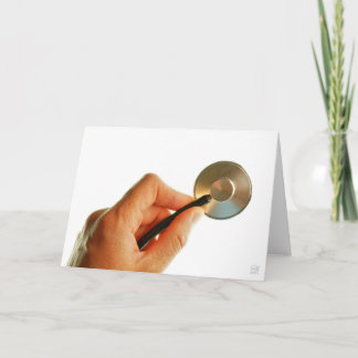 Stethoscoop in een hand voor een ziekenhuis sfeer. サンキューカード