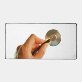 Stethoscoop in een hand voor een ziekenhuis sfeer. デスクマット