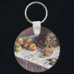 Still Life with Apple and Grues by Claude Monet キーホルダー<br><div class="desc">Still Life with Apple and Grues (1880) by Claude Monetはヴィンテージの印象派のアート素晴らし・スチル・ライフ絵画ズだ。感謝のディナーにセットされたリンゴとブドウを含むテーブルの上のバスケットの様々な果物。アーティストについて：クロード・モネ(1840-1926)は印象派の運動の創始者であフランスのり絵画、その絵画の大部分は「空中に浮かぶ」（野外に浮かぶ）スタイル印象派の風景である。</div>