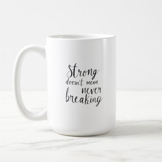 Strong doesn't mean never breaking コーヒーマグカップ (左)