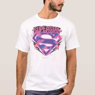 Supergirlのピンクおよび紫色のグランジなロゴ Tシャツ