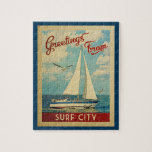 Surf City Jigsaw Puzzle Sailboat Retro New Jersey ジグソーパズル<br><div class="desc">This Greetings From Surf City New Jersey vintage travel nautical design features a boat sailing on the water with seagulls and a blue sky filled with gorgeous puffy white clouds.</div>