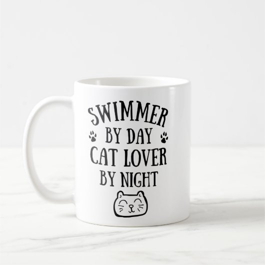 Swimmer by day. Cat lover by night. コーヒーマグカップ (左)