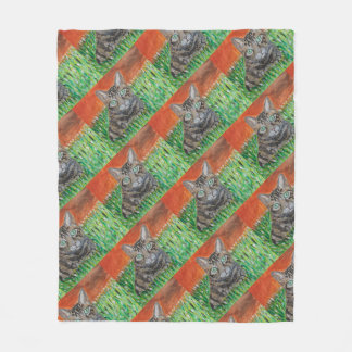 Tabby cat looking curious in grass fleece blanket  フリースブランケット