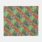 Tabby cat looking curious in grass fleece blanket  フリースブランケット (正面(横))
