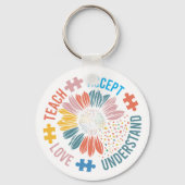 "Teach Accept Love Understand" パズルのピースの花 キーホルダー (正面)