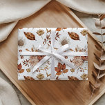 Terracotta Rust Boho Floral Fall Foliage ラッピングペーパー<br><div class="desc">Wrap your gifts in delightful autumn charm with this custom wrapping paper, featuring a captivating botanical design. A soft white background highlights a beautiful medley of warm terracotta leaves, delicate cream blooms, and subtle brown accents, creating an elegant pattern. This enchanting artwork adds a touch of seasonal beauty, making every...</div>
