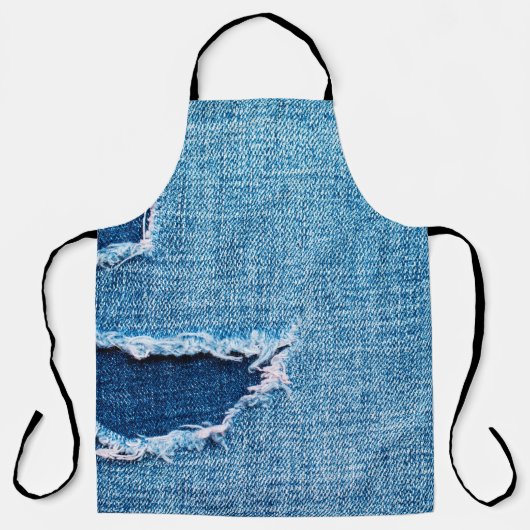 Textured denim background. Torn hole in the fabric エプロン (正面)