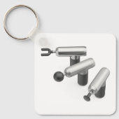 Three massage guns with different massage heads キーホルダー (正面)