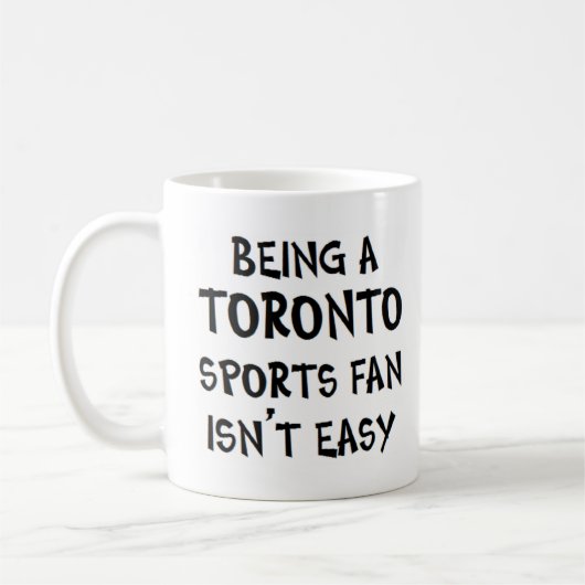 toronto sports fan, being コーヒーマグカップ (左)