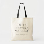 Totes Getting Married Tote Bag | Modern Script トートバッグ<br><div class="desc">This simple tote bag makes a fun gift for your favorite bride! Featuring minimal yet elegant design with a handwritten signature script and a simple sans-serif font. Personalize each bag with the bride's new name (or whatever custom text you'd like), and make additional edits by selecting "Click to customize further."...</div>