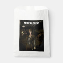 Trick or Treat. Thin female carrying lamp