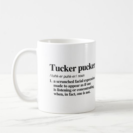 Tucker Puckerの定義 コーヒーマグカップ (左)