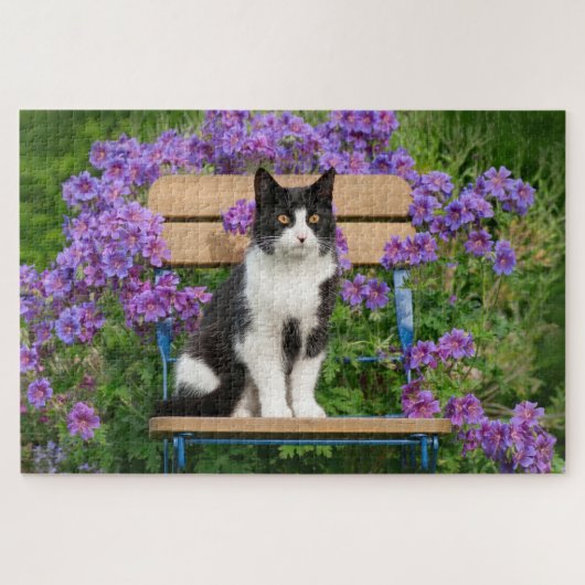Tuxedo cat sitting on a garden chair with flowers ジグソーパズル (横)