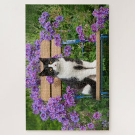 Tuxedo cat sitting on a garden chair with flowers ジグソーパズル