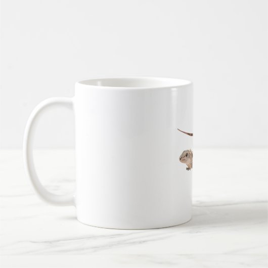 Uはイグアナのとげのある尾を利用 コーヒーマグカップ (左)