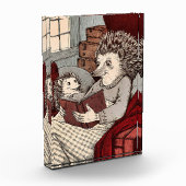 Un hérisson dans une couverture lisant un livre à  フォトブロック (左)