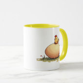 Un poussin couve un œuf. マグカップ (正面右)