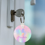 Unicorn glitter rainbow monogram name holographic キーホルダー<br><div class="desc">A trendy holographic background with unicorn and rainbow pastel colors in pink,  purple,  rose gold,  mint green. Decorated with faux glitter drips in rose gold,  pink and purple. Personalize and add your name.  Purple colored letters.  A bit of everyday glam to brighten up your day!</div>