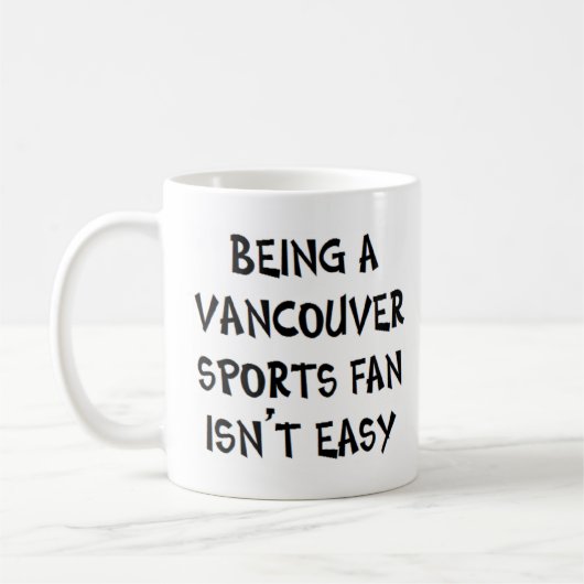vancouver sports fan, being コーヒーマグカップ (左)