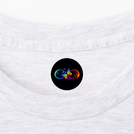 Vibrant infinity with rainbow butterfly on black ラベル (貼付)