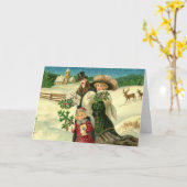 Victorian family in the snow Christmas scene カード (黄色い花)