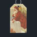Vintage Christmas ビクトリアン Santa Claus in Chimney ギフトタグ<br><div class="desc">簡単メッセージを作成するためにクリスマスギフトタグをパーソナライズするカスタムために。ヴィンテージイラストレーションビクトリアンエラメリークリスマスの休日のデザインは、クリスマスイブのおもちゃでいっぱいの袋で雪の上の屋根の登山の上にサンタクロースをフィーチャー。屋根の上に聖ニコラスとすてきとても寒い冬の夕べ。</div>