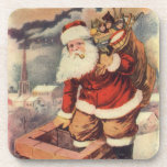 Vintage Christmas ビクトリアン Santa Claus in Chimney コースター<br><div class="desc">ヴィンテージのイラストレーションビクトリアンメリークリスマスの休日の画像すてきは、クリスマス・イブに玩具の袋でいっぱいの家の煙突の下に白い髭と帽子の登山を持つ古いサンタ・クロースを特徴とする。ハッピーホリデーと季節のご挨拶！</div>