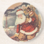 Vintage Christmas ビクトリアン Santa Claus in Chimney コースター<br><div class="desc">ヴィンテージのイラストレーションビクトリアンメリークリスマスの休日の画像すてきは、クリスマス・イブに玩具の袋でいっぱいの家の煙突の下に白い髭と帽子の登山を持つ古いサンタ・クロースを特徴とする。ハッピーホリデーと季節のご挨拶！</div>