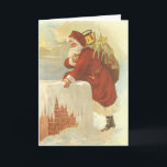 Vintage Christmas ビクトリアン Santa Claus in Chimney シーズンカード<br><div class="desc">簡単カスタマイズはクリスマスカードに自分のメッセージを追加！ヴィンテージイラストレーションビクトリアンエラメリークリスマスの休日のデザインは、クリスマスイブのおもちゃでいっぱいの袋で雪の上の屋根の登山の上にサンタクロースをフィーチャー。屋根の上に聖ニコラスとすてきとても寒い冬の夕べ。</div>