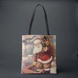 Vintage Christmas ビクトリアン Santa Claus in Chimney トートバッグ<br><div class="desc">ヴィンテージのイラストレーションビクトリアンメリークリスマスの休日の画像すてきは、クリスマス・イブに玩具の袋でいっぱいの家の煙突の下に白い髭と帽子の登山を持つ古いサンタ・クロースを特徴とする。ハッピーホリデーと季節のご挨拶！</div>