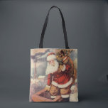Vintage Christmas ビクトリアン Santa Claus in Chimney トートバッグ<br><div class="desc">ヴィンテージのイラストレーションビクトリアンメリークリスマスの休日の画像すてきは、クリスマス・イブに玩具の袋でいっぱいの家の煙突の下に白い髭と帽子の登山を持つ古いサンタ・クロースを特徴とする。ハッピーホリデーと季節のご挨拶！</div>