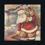 Vintage Christmas ビクトリアン Santa Claus in Chimney マグネット<br><div class="desc">ヴィンテージのイラストレーションビクトリアンメリークリスマスの休日の画像すてきは、クリスマス・イブに玩具の袋でいっぱいの家の煙突の下に白い髭と帽子の登山を持つ古いサンタ・クロースを特徴とする。ハッピーホリデーと季節のご挨拶！</div>