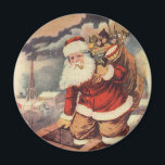 Vintage Christmas ビクトリアン Santa Claus in Chimney マグネット<br><div class="desc">ヴィンテージのイラストレーションビクトリアンメリークリスマスの休日の画像すてきは、クリスマス・イブに玩具の袋でいっぱいの家の煙突の下に白い髭と帽子の登山を持つ古いサンタ・クロースを特徴とする。ハッピーホリデーと季節のご挨拶！</div>