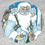 Vintage Christmas, Blue Santa Claus with Snowglobe ラウンドシール<br><div class="desc">Vintage illustration Victorian style Merry Christmas holiday design featuring a jolly Santa Claus in the forest. Saint Nicholas is dressed in a blue coat holding a snow globe in one hand, and a cane in the other. A cute teddy bear hangs from his coat and a sack of toys is...</div>