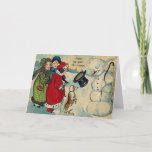 vintage christmas children シーズンカード<br><div class="desc">Digitally enhanced image of 3 victorian girls with a small dog greeting a snowman. Send a cute retro greeting to your friends this year.</div>