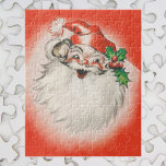 Vintage Christmas, Jolly Retro 50s Santa Claus ジグソーパズル<br><div class="desc">Vintage illustration Merry Christmas holiday design featuring a jolly Santa Claus. Old Saint Nick has a big fluffy white beard and is wearing a traditional furry hat decorated with holly leaves and berries. His laughing face is featured on a bright red background. A fun 50s retro kitschy feel.</div>