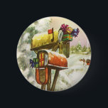 Vintage Christmas, Mailboxes in Winter Landscape 缶バッジ<br><div class="desc">Vintage illustration Victorian Era Merry Christmas holiday image featuring a snowscape with snow covered mailboxes filled with Christmas mail and presents in winter. A horse drawn carriage is driving down the snowy street with trees and a forest on the side. Happy Holidays and Season's Greetings!</div>