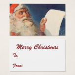 Vintage Christmas, Santa Claus いけな Nice List<br><div class="desc">おもしろいカードは休日のギフトラベルとして使用する。または、文字と詳細を変更して、お客様固有のユニークニーズに合わせてパーソナライズされた、カスタムビジネス・カードを作成する。「カスタマイズ」クリックボタンを使用して、すべてのデザインツールにアクセスし、背景色またはフォントスタイルまたは色を変更する。多くのフォントから選択!!ヴィンテージイラストレーションメリークリスマスの休日の画像すてきは、サンタクロースが赤い帽子を被り、クリスマスイブに彼のいけなまたは素敵なリストをチェックする。</div>