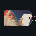 Vintage Christmas, Santa Claus いけな Nice List ギフトタグ<br><div class="desc">簡単メッセージを作成するためにクリスマスギフトタグをパーソナライズするカスタムために。ヴィンテージイラストレーションメリークリスマスの休日の画像すてきは、サンタクロースが赤い帽子を被り、クリスマスイブに彼のいけなまたは素敵なリストをチェックする。</div>